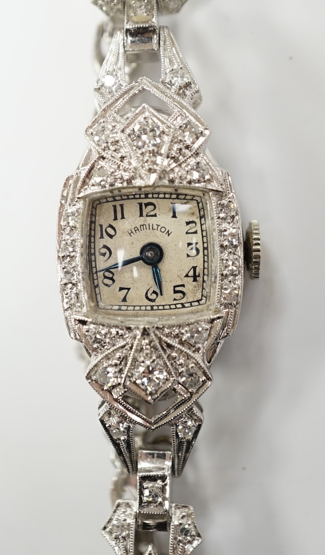 A lady's white metal (stamped irid and platinum) and diamond cluster set manual wind Hamilton cocktail watch, approx. 15cm, gross weight 24.6 grams.